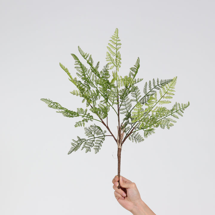 Artificial decorative fern branch