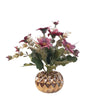 Various artificial flower arrangements in a golden porcelain pot