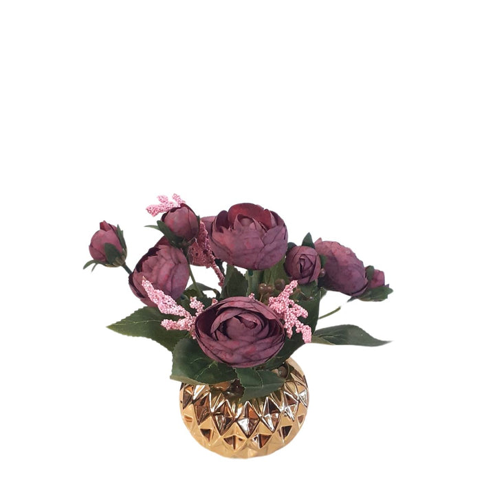 Burgundy artificial roses in a gold porcelain pot
